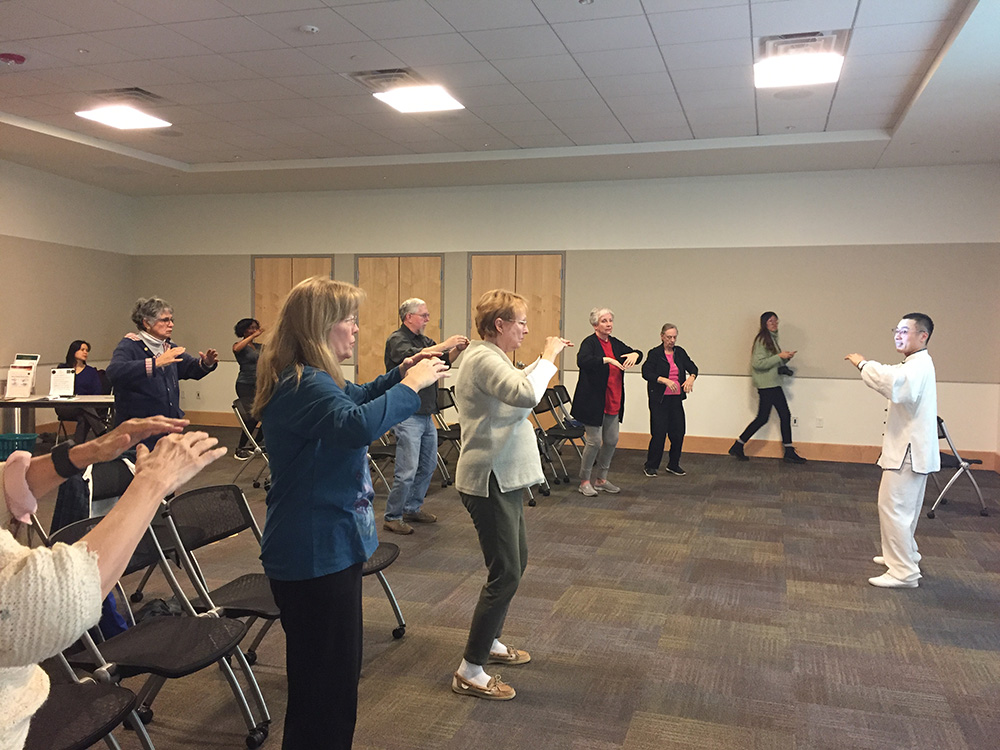 3. Xiusen Pan is teaching the community members the basic movements of Tachi